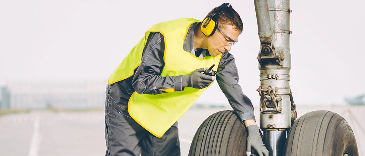 Aircraft Maintenance Technician Wearing Earplugs